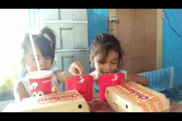 Nanami and ate Rhianne enjoying eating Jollibee